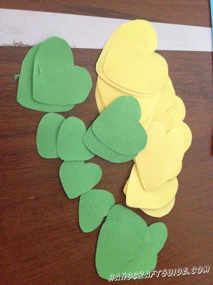 Cut the colored paper (red, yellow, green, orange) hearts